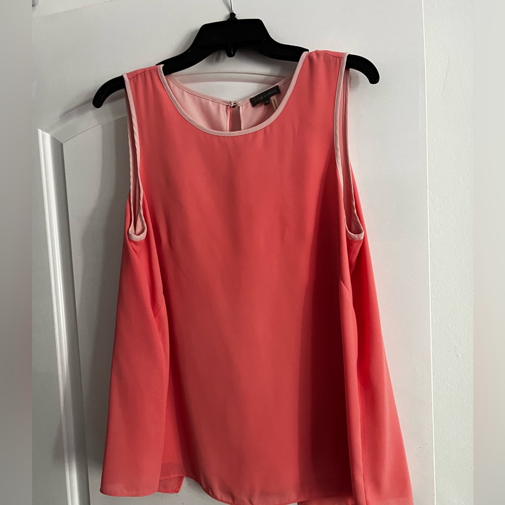 Vince Camuto sleeveless peachy top with pale peachy pink lining. Size M.